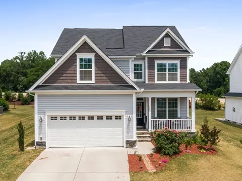 A suburban house with a garage, porch and front garden in Fuquay-Varina, NC